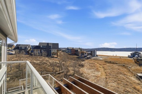 419 Cottageclub Cove, Rural Rocky View County, AB - Outdoor With Body Of Water
