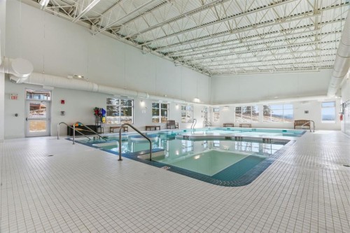 419 Cottageclub Cove, Rural Rocky View County, AB - Indoor Photo Showing Other Room With In Ground Pool