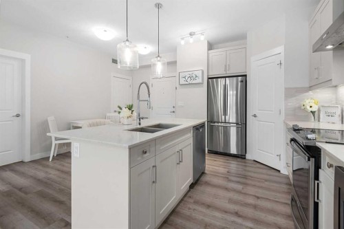311-200 Auburn Meadows Common Se, Calgary, AB - Indoor Photo Showing Kitchen With Stainless Steel Kitchen With Double Sink With Upgraded Kitchen