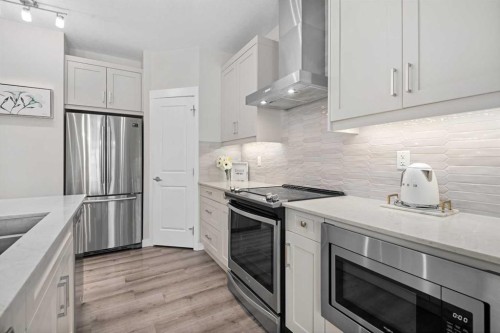 311-200 Auburn Meadows Common Se, Calgary, AB - Indoor Photo Showing Kitchen With Stainless Steel Kitchen With Upgraded Kitchen