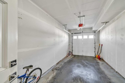 103-116 Saddlestone Heath Ne, Calgary, AB - Indoor Photo Showing Garage