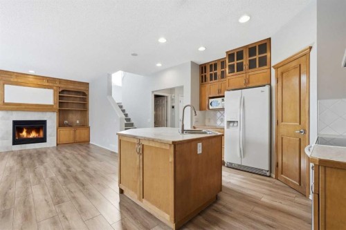 15172 Prestwick Boulevard Se, Calgary, AB - Indoor Photo Showing Kitchen With Fireplace With Double Sink