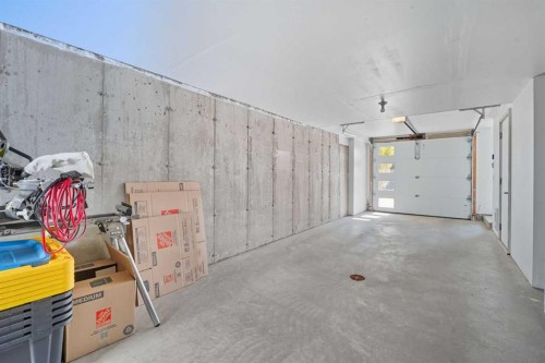 102-474 Seton Circle Se, Calgary, AB - Indoor Photo Showing Garage