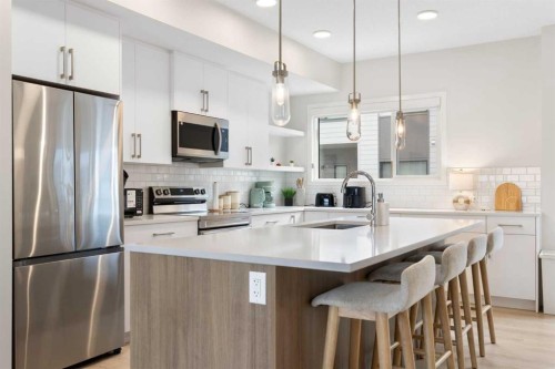 608-20295 Seton Way Se, Calgary, AB - Indoor Photo Showing Kitchen With Stainless Steel Kitchen With Upgraded Kitchen