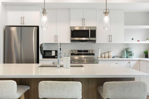 608-20295 Seton Way Se, Calgary, AB - Indoor Photo Showing Kitchen With Stainless Steel Kitchen With Upgraded Kitchen