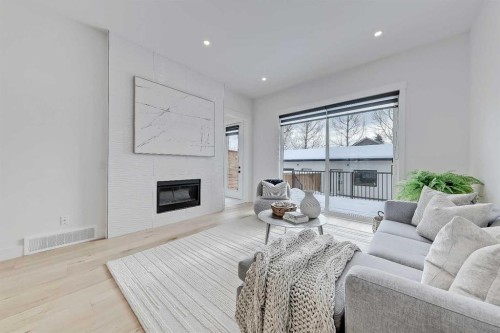 523 55 Avenue Sw, Calgary, AB - Indoor Photo Showing Living Room With Fireplace