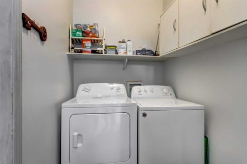38 Millbank Hill Sw, Calgary, AB - Indoor Photo Showing Laundry Room