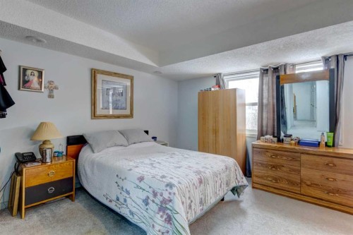 38 Millbank Hill Sw, Calgary, AB - Indoor Photo Showing Bedroom