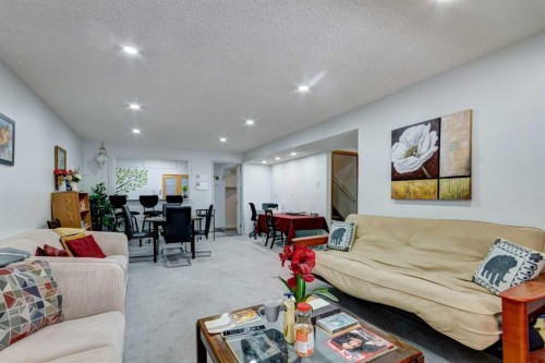 38 Millbank Hill Sw, Calgary, AB - Indoor Photo Showing Living Room