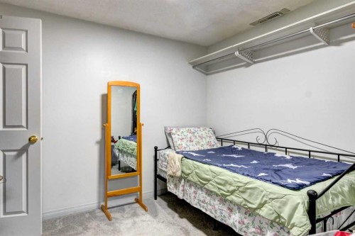 38 Millbank Hill Sw, Calgary, AB - Indoor Photo Showing Bedroom