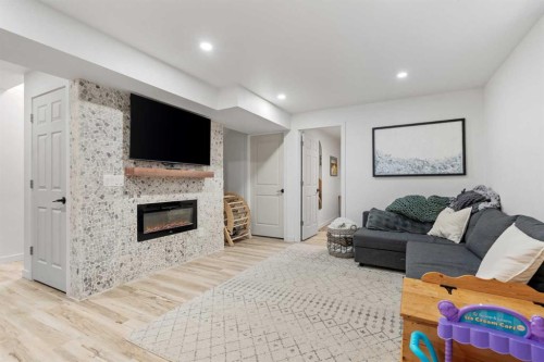 168 Chaparral Ridge Circle Se, Calgary, AB - Indoor Photo Showing Living Room With Fireplace
