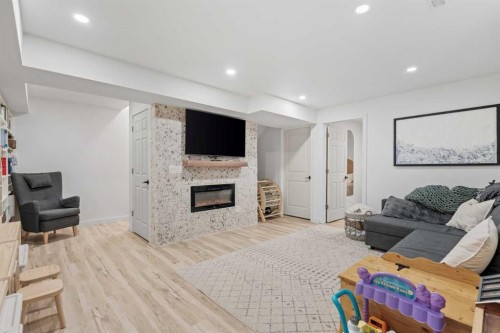 168 Chaparral Ridge Circle Se, Calgary, AB - Indoor Photo Showing Living Room With Fireplace