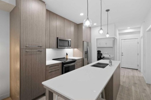 2408-76 Cornerstone Passage Ne, Calgary, AB - Indoor Photo Showing Kitchen With Double Sink With Upgraded Kitchen