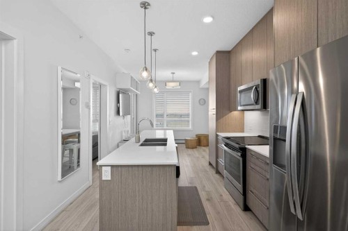 2408-76 Cornerstone Passage Ne, Calgary, AB - Indoor Photo Showing Kitchen With Stainless Steel Kitchen With Double Sink With Upgraded Kitchen