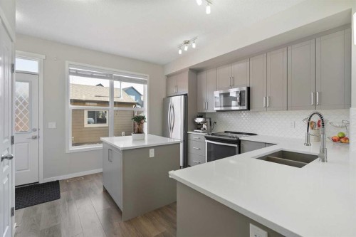 849 Mahogany Boulevard Se, Calgary, AB - Indoor Photo Showing Kitchen With Double Sink With Upgraded Kitchen