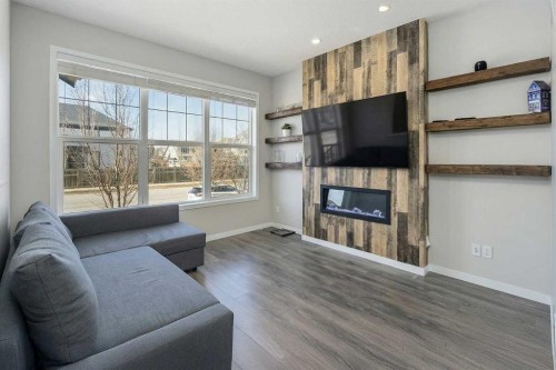 849 Mahogany Boulevard Se, Calgary, AB - Indoor Photo Showing Living Room With Fireplace