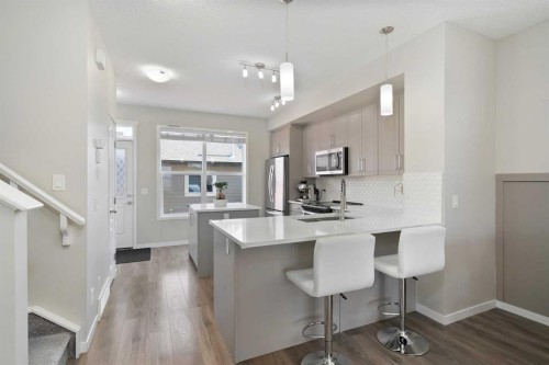 849 Mahogany Boulevard Se, Calgary, AB - Indoor Photo Showing Kitchen With Double Sink With Upgraded Kitchen