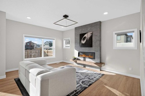 78 Silverton Glen Crescent Sw, Calgary, AB - Indoor Photo Showing Living Room With Fireplace