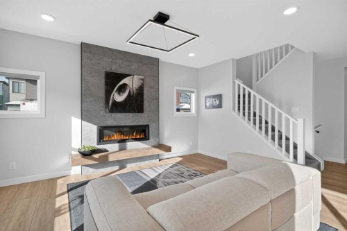 78 Silverton Glen Crescent Sw, Calgary, AB - Indoor Photo Showing Living Room With Fireplace
