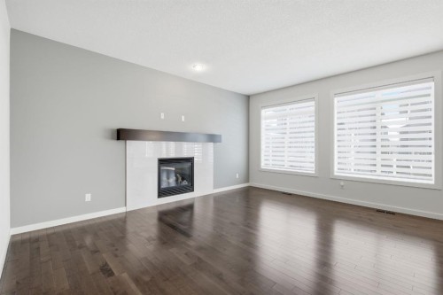 101 Evansborough Green Nw, Calgary, AB - Indoor Photo Showing Living Room With Fireplace