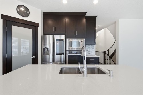 101 Evansborough Green Nw, Calgary, AB - Indoor Photo Showing Kitchen With Stainless Steel Kitchen With Double Sink With Upgraded Kitchen