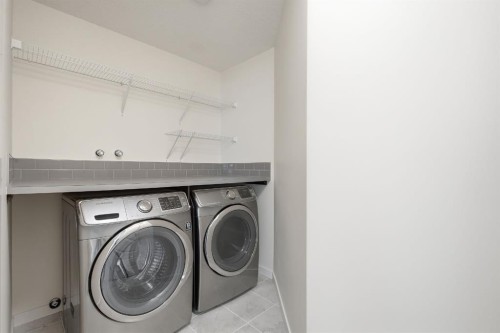 101 Evansborough Green Nw, Calgary, AB - Indoor Photo Showing Laundry Room