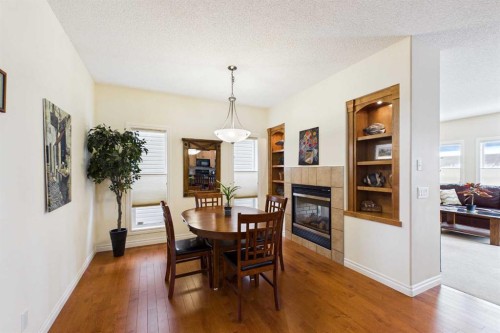 167 Evanston View Nw, Calgary, AB - Indoor Photo Showing Dining Room With Fireplace
