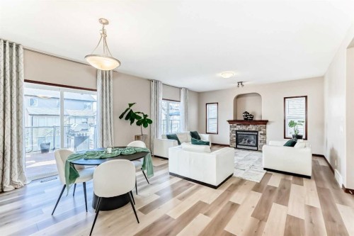 148 Hawkmere Way, Chestermere, AB - Indoor Photo Showing Other Room With Fireplace