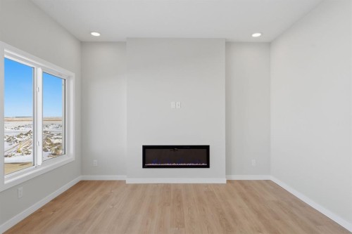 84 Lewiston View Ne, Calgary, AB - Indoor Photo Showing Other Room With Fireplace
