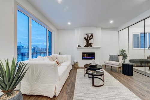 128 Sunrise Heath, Cochrane, AB - Indoor With Fireplace