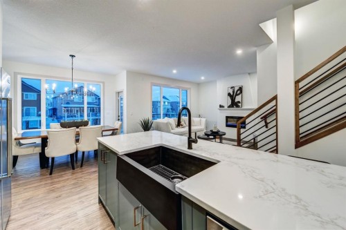 128 Sunrise Heath, Cochrane, AB - Indoor Photo Showing Kitchen