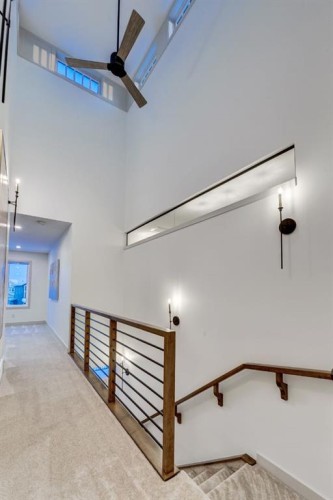 128 Sunrise Heath, Cochrane, AB - Indoor Photo Showing Other Room