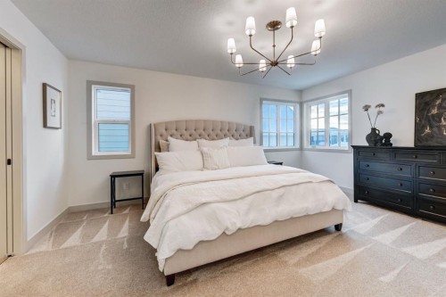 128 Sunrise Heath, Cochrane, AB - Indoor Photo Showing Bedroom