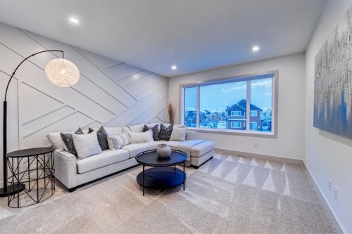 128 Sunrise Heath, Cochrane, AB - Indoor Photo Showing Living Room