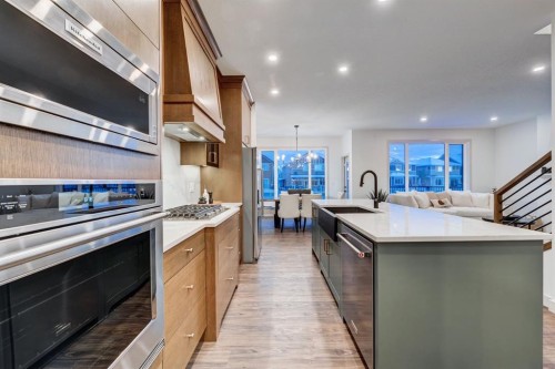 128 Sunrise Heath, Cochrane, AB - Indoor Photo Showing Kitchen With Upgraded Kitchen