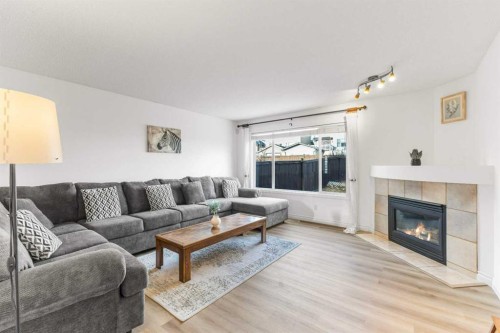 26 Arbour Butte Way Nw, Calgary, AB - Indoor Photo Showing Living Room With Fireplace