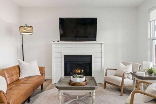 50 Riviera View, Cochrane, AB - Indoor Photo Showing Living Room With Fireplace