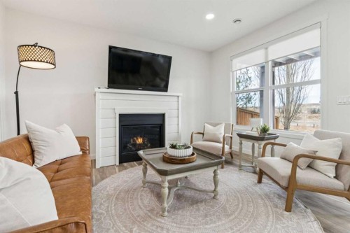 50 Riviera View, Cochrane, AB - Indoor Photo Showing Living Room With Fireplace