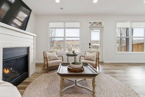 50 Riviera View, Cochrane, AB - Indoor Photo Showing Living Room With Fireplace