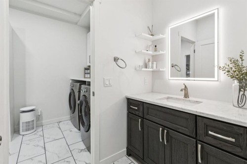 50 Riviera View, Cochrane, AB - Indoor Photo Showing Laundry Room