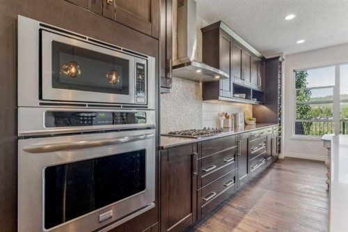 50 Riviera View, Cochrane, AB - Indoor Photo Showing Kitchen With Upgraded Kitchen