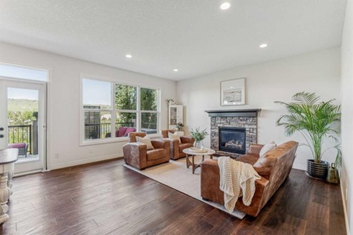 50 Riviera View, Cochrane, AB - Indoor Photo Showing Living Room With Fireplace