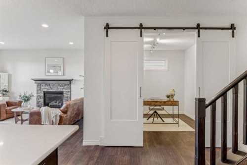 50 Riviera View, Cochrane, AB - Indoor With Fireplace