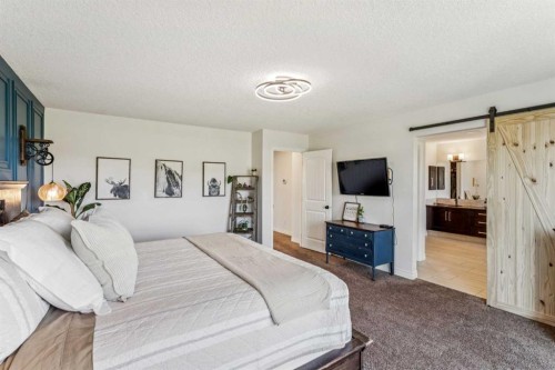 50 Riviera View, Cochrane, AB - Indoor Photo Showing Bedroom