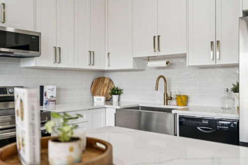 50 Riviera View, Cochrane, AB - Indoor Photo Showing Kitchen With Upgraded Kitchen