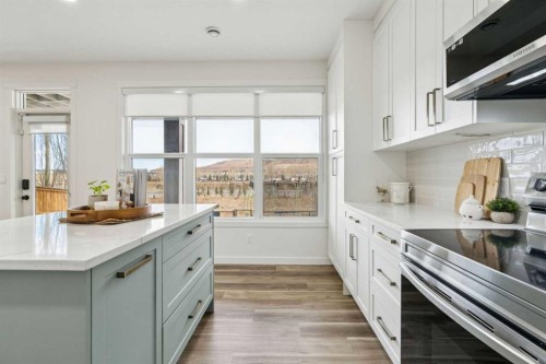 50 Riviera View, Cochrane, AB - Indoor Photo Showing Kitchen With Upgraded Kitchen
