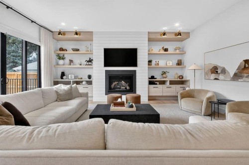 6515 Longmoor Way Sw, Calgary, AB - Indoor Photo Showing Living Room With Fireplace