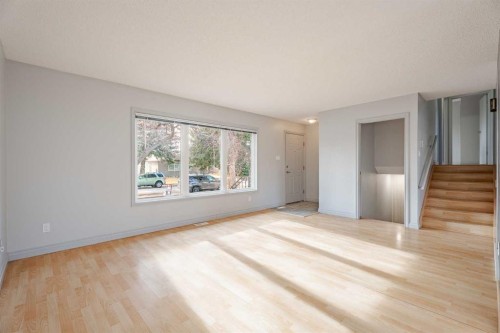 4707 Brockington Road Nw, Calgary, AB - Indoor Photo Showing Living Room