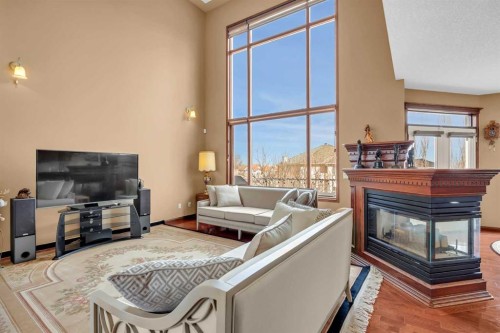 10409 Hamptons Boulevard Nw, Calgary, AB - Indoor Photo Showing Living Room With Fireplace