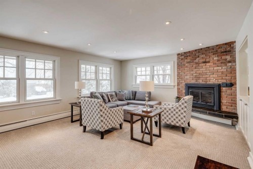 3920 Crestview Road Sw, Calgary, AB - Indoor Photo Showing Living Room With Fireplace